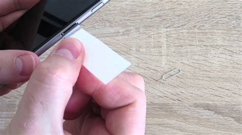 How to remove a stuck SIM card from iPhone .